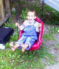 Barefoot Kayden on the swing