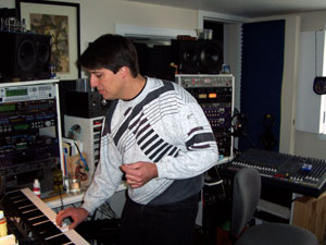 Scott MacGougan playing keyboards at Silent T Studios